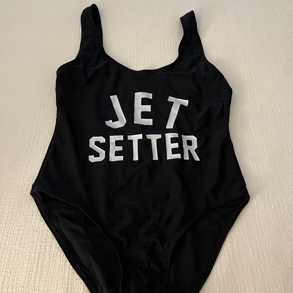 Black One Piecece
Jet Setter